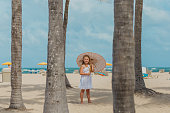 Blonde girl playing on the beach, Fort Lauderdale, Florida